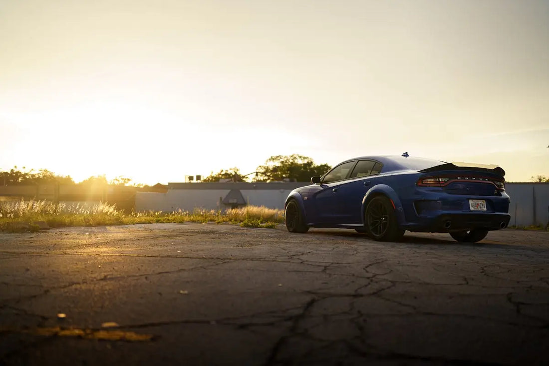 a blue car parked on a road