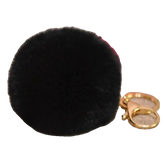 Black fluffy keychain with a gold clasp on a white background