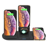Multi-device wireless charging station with four devices on a white background