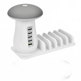 White and gray charging station with multiple USB ports and plug types displayed.