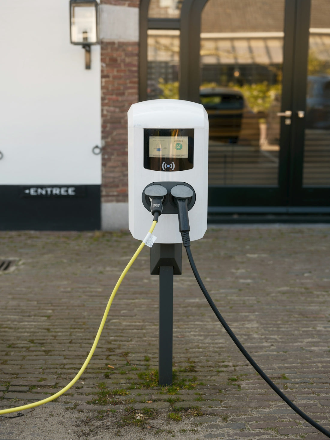 An electric vehicle charger is plugged in.