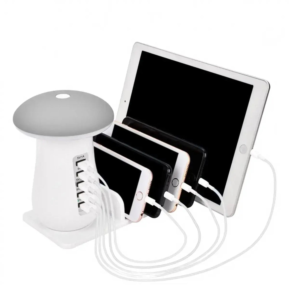 White charging station with multiple devices connected on a white background