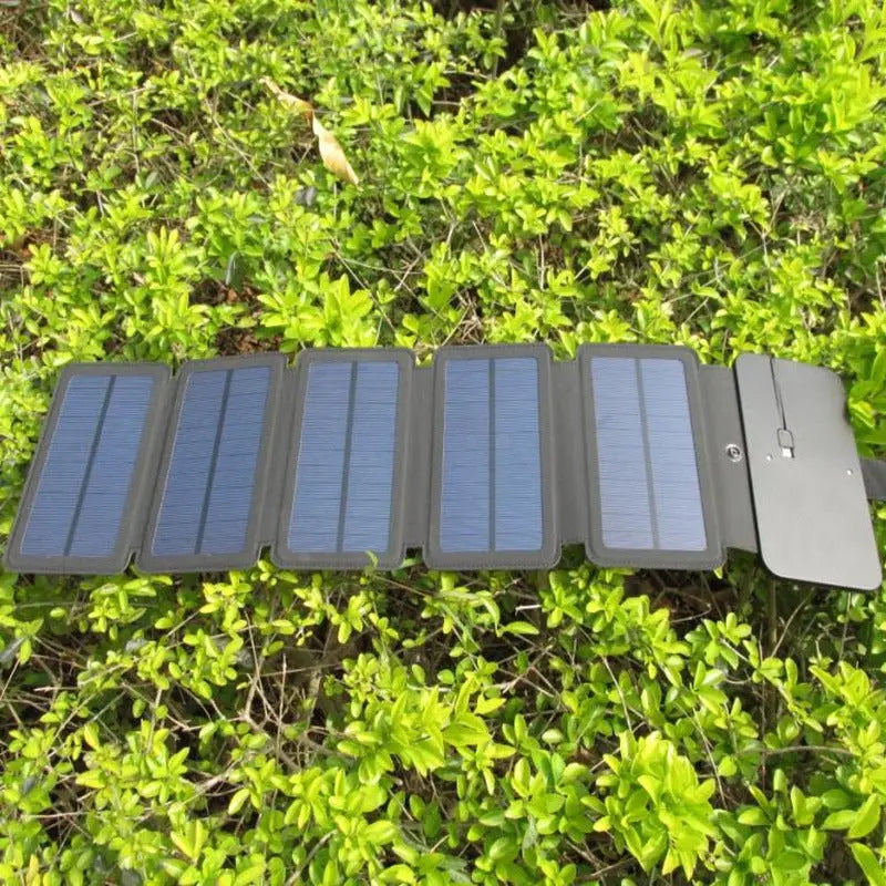 Foldable solar panel on a grassy background