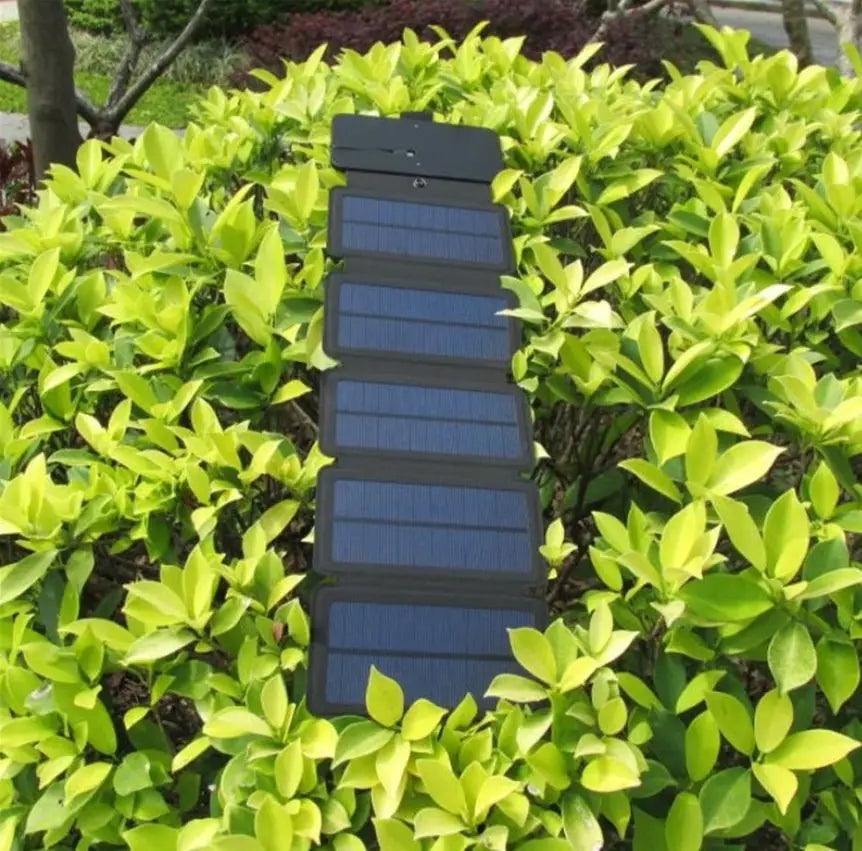 Foldable solar panel in a green bush