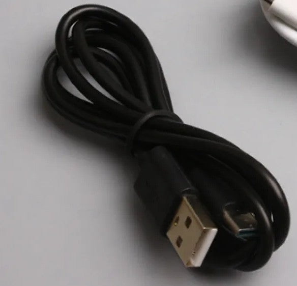Black USB cable on a gray surface