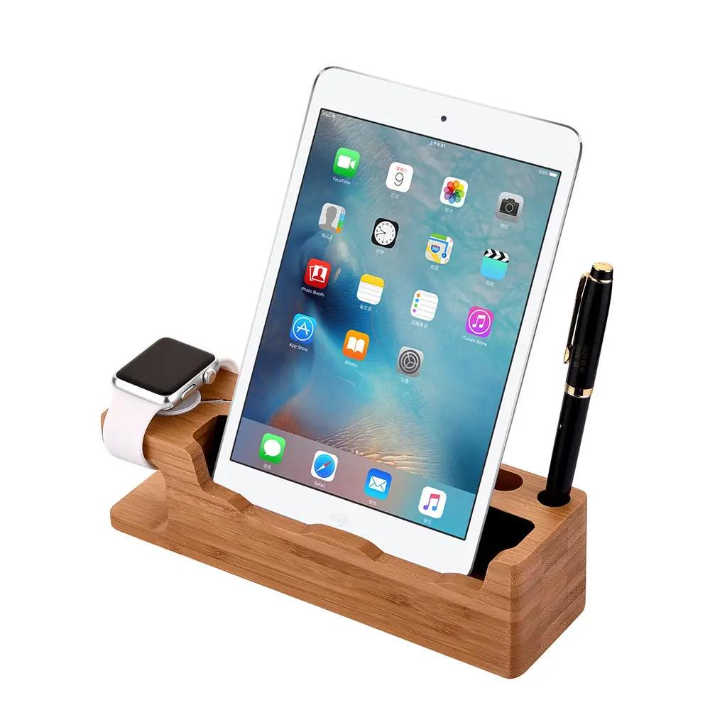 Wooden desk organizer with tablet, smartwatch, and pen on a white background