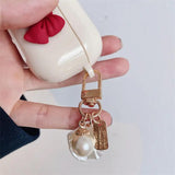 Beige Red Bow Shell Pendant Wireless Earphone Case Charge Hub X