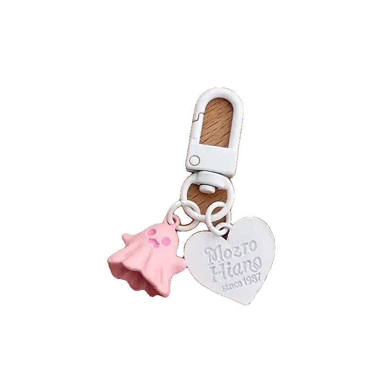 Keychain with pink shell and heart-shaped tag on a white background