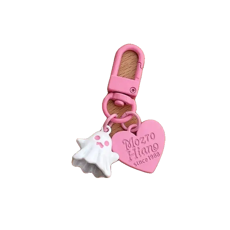 Pink keychain with heart-shaped tag and shell charm on a white background