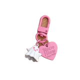 Pink keychain with heart-shaped tag and shell charm on a white background