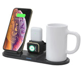 Multi-device charging station with smartphone, smartwatch, and coffee mug on a white background