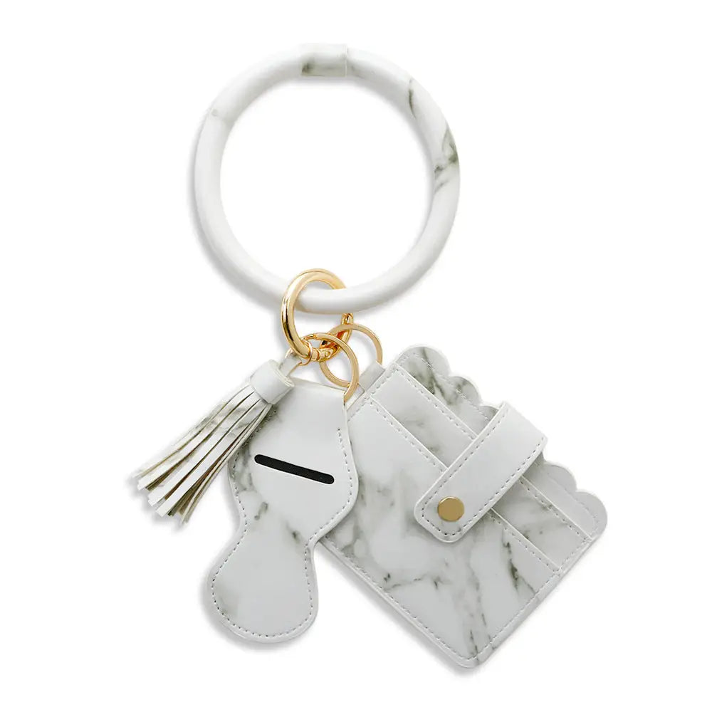 Marble-patterned keychain with tassel and small pouch on a white background