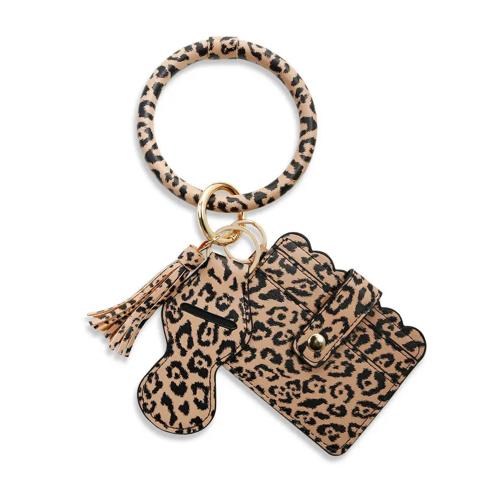 Leopard print keychain with matching card holder on a white background