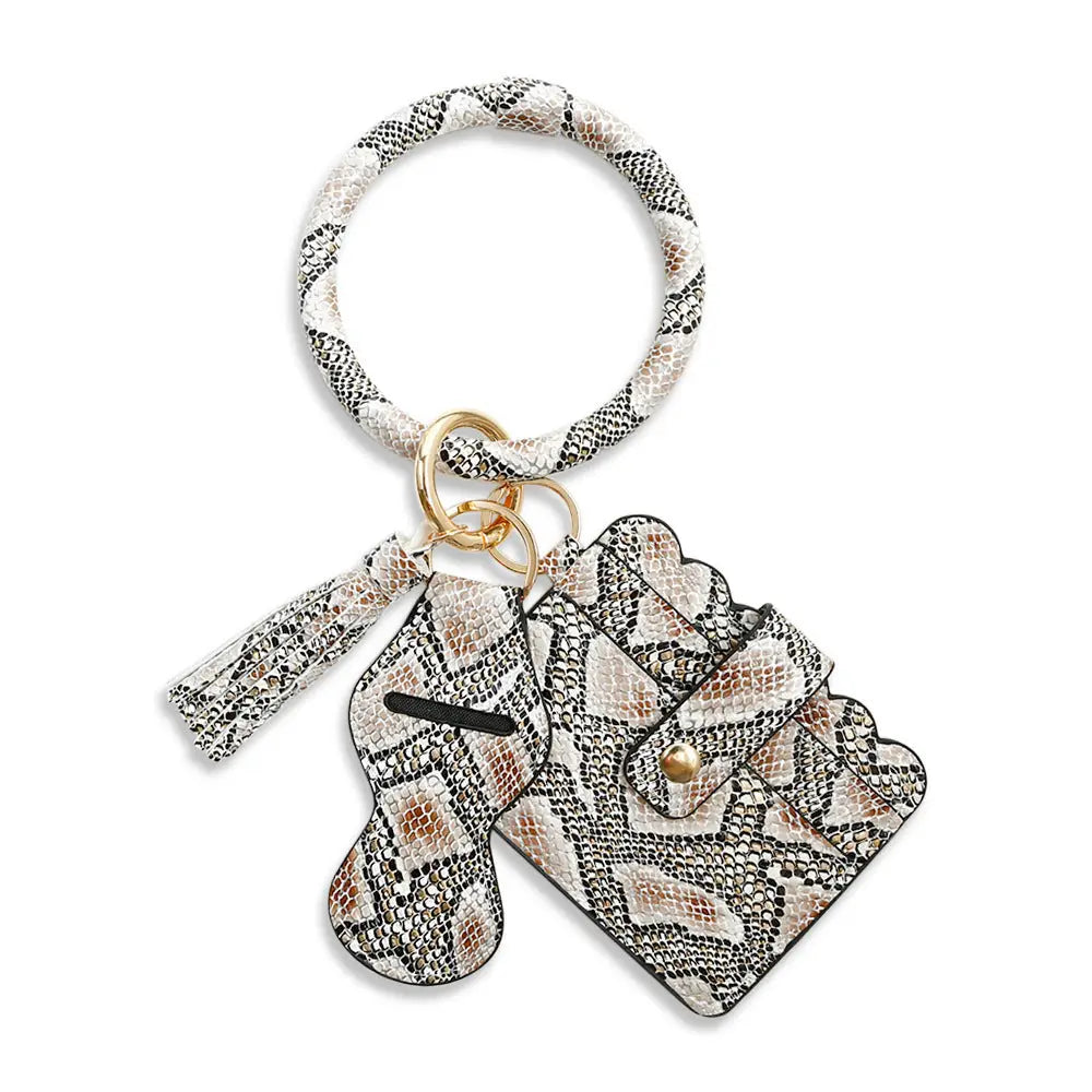 Snakeskin-patterned keychain with a hair tie and card holder on a white background
