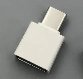 USB-C to USB-A adapter on a gray background