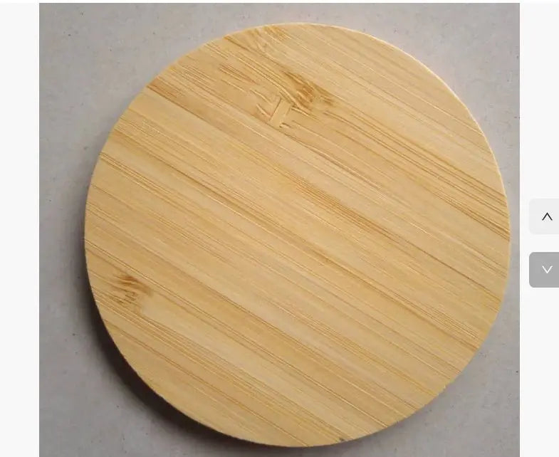 Round wooden cutting board on a gray surface